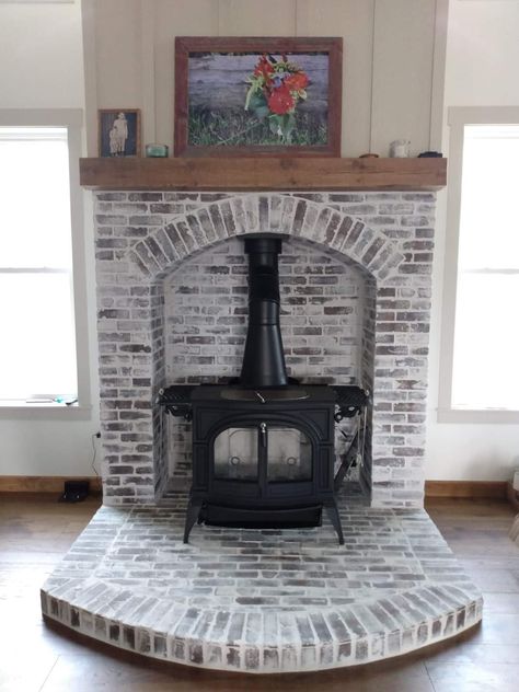 Inside Chimney Ideas, Wood Stove Brick Surround, Wood Stove With Fireplace Surround, Small Wood Burning Stove Ideas, Farmhouse Wood Burning Stove, Wood Stove Center Of Room, Brick Wood Stove Hearth, Wood Burner Stove Living Rooms, Woodstoves In Living Rooms