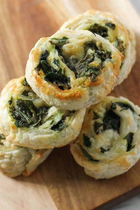 Spinach and Feta Pinwheels made from puff pastry and fresh spinach are great for easy snacks or an appetiser for parties.  These vegetarian spinach and feta scrolls are always a hit with kids and adults alike.  These pinwheels can be made in the oven or the air fryer, and they freeze well, so make a big batch and reheat when you're ready.   #pinwheels #spinachfetapinwheels Spinach And Feta Pastry Rolls, Air Fryer Spinach Recipes, Air Fryer Pinwheels, Air Fryer Puff Pastry Recipes, Feta Pinwheels, Spinach Appetizers, Spinach Puff Pastry, Greek Spinach, Spinach Rolls