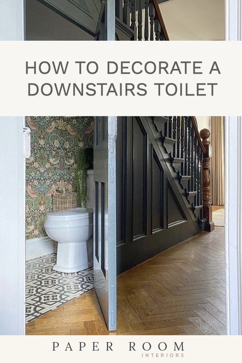 A step by step guide on how to decorate a downstairs toilet to create a practical and beautiful space for you and your guests. Small Guest Toilet Decor, Understairs Toilet Wallpaper, Tiny Powder Rooms Under Stairs, Under Stairs Toilet Wallpaper, Scandi Downstairs Toilet, Cloakroom Toilet Floor Tiles, Victorian Cloakroom Toilet, Downstairs Toilet Sloped Ceiling, Scandi Cloakroom Toilet