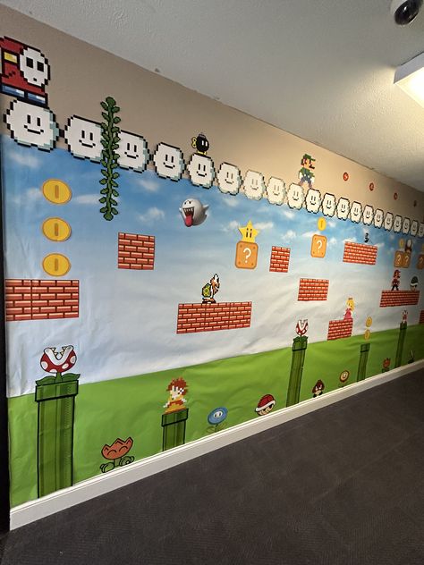 Super Mario Brick Wall, Mario World Decorations, Mario School Decorations, Mario Brothers Classroom Theme, Mario Vbs Decorations, Mario Playroom, Mario Bulletin Board, Super Mario Decorations Diy, Vbs Twists And Turns