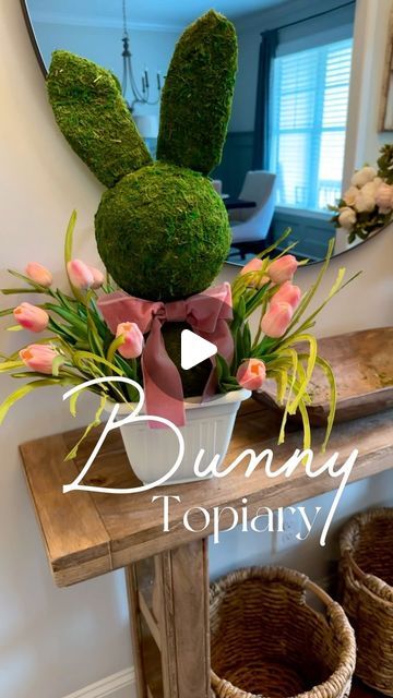 Liz Grella on Instagram: "The cutest DIY bunny topiary! 🐰
Super cute & pretty simple craft for Easter or Spring! 

Items you’ll need to make your own:

-7.6”craft foam ball
-6.6”craft foam ball
-3 packs of mossy mat peel ‘n stick{LOVED using peel n stick, instead of gluing moss. I found it to be easy to use and molded beautifully on the ball}
-36” dowel{i cut mine and used it for the body and ears}
-Bunny ears-i would recommend NOT using fuzzy ones like I did. 

-Planter-mine is from Dollar tree and was the perfect size. 
-Optional:grass, tulips,bow/ribbon

For links to everything i used comment BUNNY

#bunnytopiary #rabbittopiary #diycraft #easterdiy #easterdecor #springdecor #topiary #springdecorating #easterbunny #springdiy #springcrafts #easycrafts #mossball #mossbunny" Bunny Topiary, Craft For Easter, Diy Bunny, Ribbon Ideas, Craft Foam, Moss Balls, Simple Craft, Easter Projects, Bow Ribbon