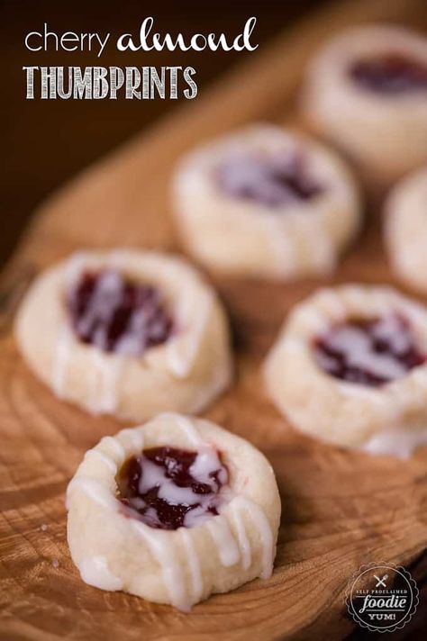 Cherry Almond Thumbprints pair the delicious flavors of cherry preserves and almond to make a buttery shortbread cookie that is perfect for the holidays. #thumbprints #thumbprintcookies #cherry #almond #easy #recipe #jam #christmas #iced #best Almond Meltaway Cookies, Raspberry Almond Thumbprint Cookies, Almond Thumbprint Cookies, Meltaway Cookies, Cherry Preserves, Cherry Cookies, Buttery Shortbread Cookies, Raspberry Almond, Cherry Almond