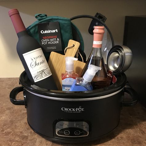 Slow cooker crockpot gift basket Crockpot Gift Basket, Crockpot Raffle Basket Ideas, Themed Basket For Raffle, Home Decor Raffle Basket Ideas, Crockpot Gift Basket Ideas, Cooking Raffle Basket Ideas, Crockpot Gifts, Raffle Basket With Blanket, Sublimation Raffle Basket