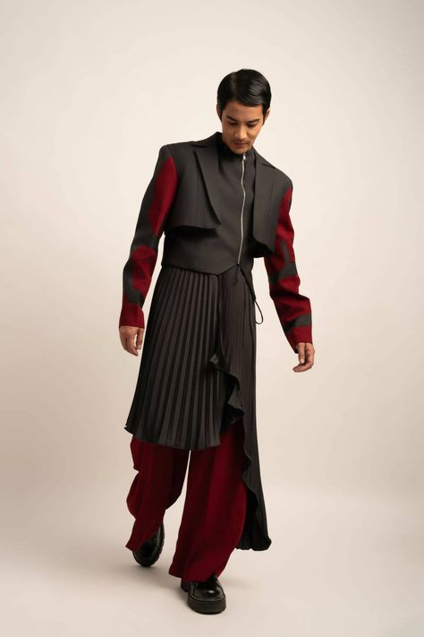 Made in IndiaMaroon trousers flow into wide legs, while the pleated skirt, worn as a luxurious wrap around the waist, adds a dynamic touch. A lavish ensemble fit for elite gatherings and sophisticated affairs.FabricsShell: TR Suiting, IndiaMaintenance• Dry Clean Only• Do Not Bleach• Steam Iron OnlyModel is wearing UK Size Medium, Height 181 cmXS: 36 inches (bust), 33 inches (waist), 38 inches (hips)S: 38 inches (bust), 35 inches (waist), 40 inches (hips)M: 40 inches (bust), 37 inches (waist), 42 Male Avant Garde Fashion, Men’s Haute Couture, Guys In Skirts Fashion, Masculine Skirt Outfit, Men Skirt Outfits, Interesting Suits, Male High Fashion, Unique Mens Fashion, High Fashion Suit