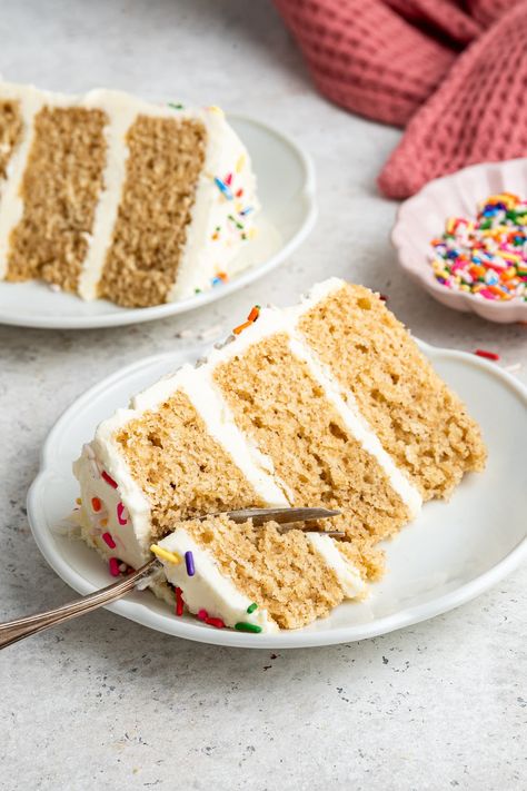 This healthy vanilla cake is made with whole wheat flour, yogurt and maple syrup. It's more nutrient-dense and lower in sugar when compared to traditional cake, but still just as delicious! Healthy Vanilla Cake, Healthy Birthday Cakes, Dairy Free Yogurt, Yogurt Flavors, Vanilla Buttercream Frosting, Pastry Flour, Traditional Cakes, Fancy Desserts, Vanilla Yogurt