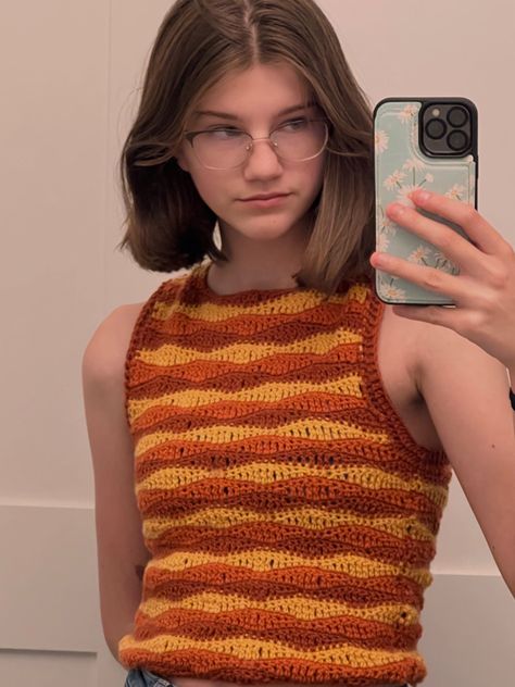 orange and yellow wave stitch crochet tank top Wave Stitch Crochet Top, Orange Top Crochet, Crochet 80s Clothes, Crochet Wave Top, Orange Crochet Projects, Crochet Orange Top, Orange Crochet Ideas, Wave Crochet Pattern, Yellow Crochet Projects