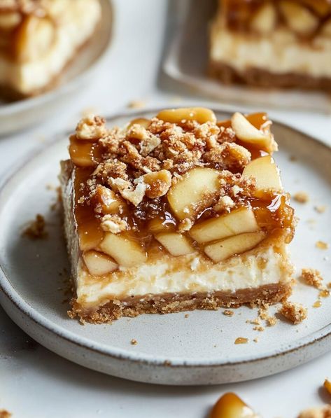 These Salted Caramel Apple Cheesecake Bars are a delightful fusion of autumn flavors and rich textures. No Bake Caramel Apple Cheesecake Bars, Carmel Apple Cheesecake Bars, Carmel Cheesecake, Gluten Free Caramel Apples, Caramel Cheesecake Bars, Apple Cheesecake Bars, Caramel Apple Cheesecake Bars, Salted Carmel, Cheesecake Squares