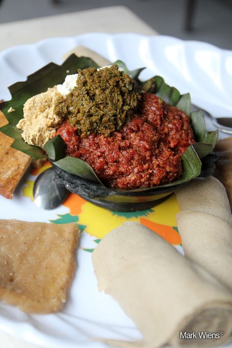 Kitfo in Ethiopia Ethiopian Kitfo, Ethiopia Recipes, Eritrean Food, Ethiopian Dishes, Ethiopian Recipes, Raw Beef, Ethiopian Cuisine, Veal Recipes, Spiced Butter