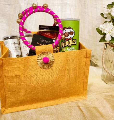 Make your wedding guests feel warm and special and welcome them with these reusable room hamper baskets, bags and trays options. Room Hampers For Wedding Guests, Indian Wedding Welcome Bags, Gift Hampers For Wedding Guests, Welcome Hampers For Wedding Guests, Welcome Hampers For Wedding Guests Indian, Indian Wedding Favors For Guests Welcome Bags, Wedding Hampers For Guests Basket Ideas, Room Baskets For Wedding, Room Hampers For Weddings