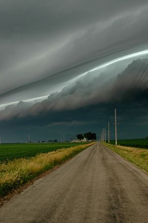 Stormy morning. The stadium effect. The eyewall of the hurricane curved ’round them like a bowl, like a stadium.  Photography by Rachel Gardner Weather Cloud, Storm Chasing, Wild Weather, Dirt Road, Storm Clouds, Alam Yang Indah, Sky And Clouds, Natural Phenomena, A Storm