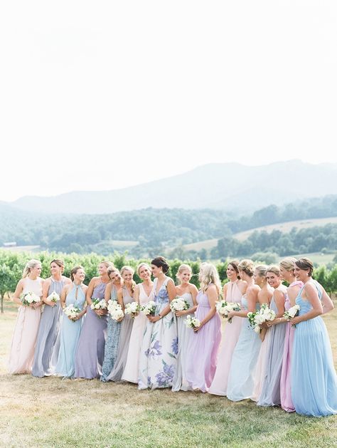 a lineup of mix and match pastel bridesmaid dresses | Photography: Luna de Mare Bridesmaid Dress Mix And Match, Iridescent Bridesmaid Dress, Bridesmaid Pastel Dresses Color Schemes, Pastel Shades Bridesmaid Dresses, Bridesmaid Dresses Pastel Purple, Pastel Wedding Theme Color Schemes Bridesmaid Dresses, Bridesmaid Pastel Dresses, Blue Purple Bridesmaid Dresses, Lavender And Pink Bridesmaid Dresses