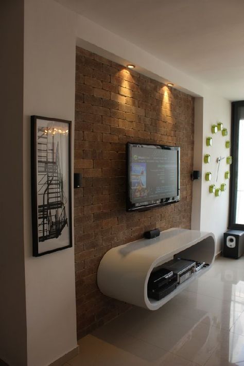 Love the texture of the wall with the modern floating cabinet and mounted TV. Simple and clean and contemporary. Living Room With Brick Wall, Tv Kastenwanden, Lcd Wall, Simple Living Room Designs, Wall Mounted Tv Cabinet, Tv Mounted, Theater Rooms, Tv Fal, Brick Interior