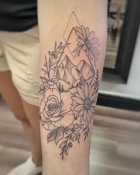 92 Breathtaking Mountain Tattoo Ideas To Watch Out In 2023 Country Flowers Tattoo, Mountain Tattoo Women Arm, Mountain Thigh Tattoo Women, Mountain Tattoo With Flowers, Mountain Tattoos For Women Arm, Mountain Half Sleeve Tattoo Women, Leg Mountain Tattoo, Mountain With Flowers Tattoo, Flower Mountain Tattoo