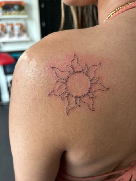 Rapunzels Flower Tattoo, Sun In Rapunzel, Repunzal Tattoo Ideas, Rapenzul Tattoo, Flower From Rapunzel Tattoo, Yellow Word Tattoo, Rapunzel Tangled Tattoo, Tangled Movie Tattoos, Rapunzel Aesthetic Tattoo