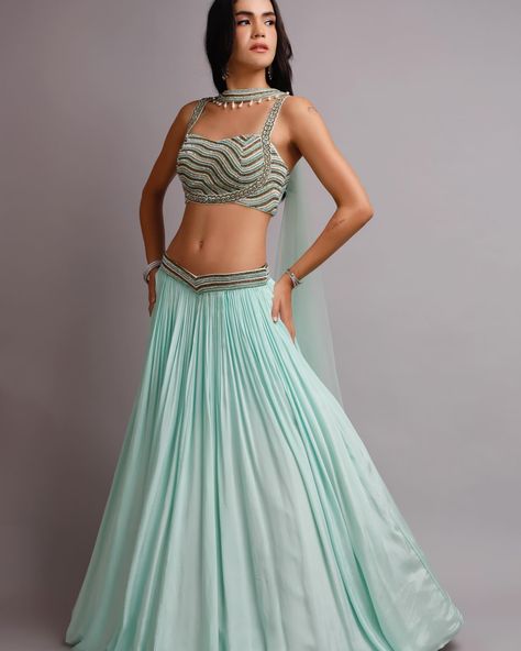 Itroducing our stunning Aqua crepe Lehenga, adorned with intricate crystal embroidery, ensuring you sparkle with every step. Paired with a blouse featuring unique pattern. The lehenga itself boasts a modern touch with a convenient pocket attached, this ensemble exudes elegance and unforgettable statement. Flaunt complete your ensemble with a regal choker dupatta, elevating your look to pure sophistication radiant confidence with enchanting ensemble. Order Now!! For enquiry and Whatzapp cal... Crepe Lehenga, Choker Dupatta, Crystal Embroidery, Unique Patterns, Order Now, Lehenga, Choker, Sparkle, Confidence