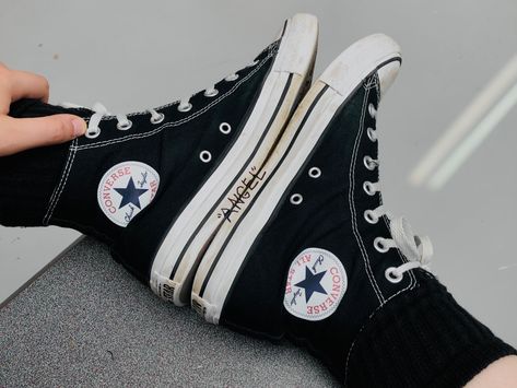 Someone in converse hightops putting their soles together. Writing on the converse reveal the word “Angel” in quotes. Please do not repost! Words On Converse, Writing On Converse, Converse Quotes, Converse Hightops, Grunge Shoes, Shoe Ideas, Converse High Tops, Please Do, High Tops