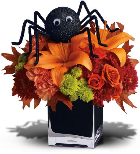 A big black spider creeps your way to wish you a Happy Halloween! This fun Halloween floral decoration presents lush orange and green flowers in a spirited black glass vase. It's a spooky sweet selection when you want to send a Halloween arrangement to a favorite child or fun-loving friend. Halloween Flower Arrangements, Halloween Floral Arrangements, Halloween Floral, Sweet Bouquet, Halloween Flowers, Halloween Centerpiece, Fall Floral Arrangements, Adornos Halloween, Halloween Table