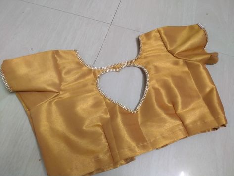 Gold blouse with heart shape neck design Heart Shape Blouse Design, Heart Shape Neck Design, Heart Shape Neck, Blouse Back Neck, Blouse Back Neck Designs, Blouse Back, Back Neck Designs, Gold Blouse, Blouse Neck