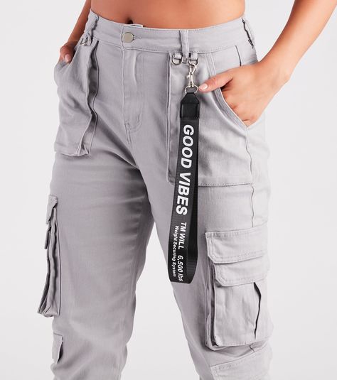 Bring attention to any chic outfit with these must-have cargo joggers! These high-waist women's pants feature cargo pockets accented with metal ring trims and a straight-leg silhouette designed with an elastic hem for a sporty-inspired look. Create a casually chic 'fit with a sleek crop top or get a little dressy with a lace bustier bodysuit. 
 Fit & Features 
 
 High-rise waist 
 Single-button and zipper closure 
 Slanted pockets and cargo-style pockets 
 Accent tab reading "Good Vibes" 
 Straight leg fit with elastic cuffed jogger hems 
 Cargo knit fabric 
 Relaxed fit, moderate stretch 
 Runs true to size 
 Selected fashion products to make you show your confidence and charm Bustier Bodysuit, Cuffed Joggers, Lace Bustier, Cargo Joggers, Silhouette Design, Chic Outfits, Straight Leg, Pants For Women, Relaxed Fit