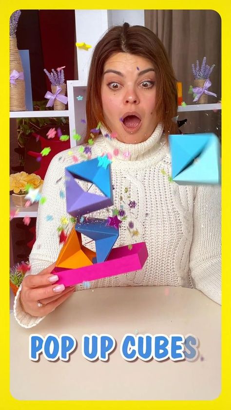 This video features an easy tutorial on how to make an amazing pop-up cubes gift box for pranks. Follow detailed instructions on how to fold jumping cubes in an exploding box and create an awesome surprise gift box for your loved ones. You need just cardboard, confetti, rubber bands and a bit of patience. Triple pop-up cubes box will be a cool gift for any occasion. Three cubes that suddenly jump out of a cute gift box will be of great fun. Jumping Cubes, Pop Up Cubes, Exploding Gift Box, Surprise Gift Box, Hadiah Diy, Pola Macrame, Paper Craft Videos, Handmade Gifts Diy, Surprise Box Gift