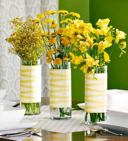 Cylindrical vases wrapped in patterned paper and filled with yellow blossoms make a cheery centerpiece. More spring centerpiece ideas: http://www.midwestliving.com/homes/seasonal-decorating/50-bright-and-easy-spring-decorating-ideas/?page=32 Brunch Decorations, Spring Table Centerpieces, Spring Mantel Decorating Ideas, Brunch Table Setting, Centerpieces Table, Brunch Decor, Brunch Table, Yellow Blossom, Spring Brunch