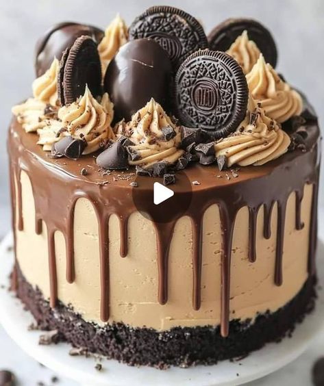 Receitas e sabores do Brasil on Instagram: "🍫🥜 Bolo Irresistível de Ganache de Chocolate com Crosta de Manteiga de Amendoim e Oreo
Ingredientes:
Para a Crosta de Manteiga de Amendoim e Oreo:

250g de biscoitos Oreo, triturados
1/2 xícara de manteiga de amendoim cremosa
1/4 xícara de manteiga derretida
Para o Bolo de Chocolate:

1 3/4 xícara de farinha de trigo
3/4 xícara de cacau em pó
1 1/2 colher de chá de fermento em pó
1 1/2 colher de chá de bicarbonato de sódio
1 xícara de açúcar
1/2 xícara de açúcar mascavo
2 ovos grandes
1 xícara de leite
1/2 xícara de óleo vegetal
2 colheres de chá de extrato de baunilha
1 xícara de água fervente
Para o Ganache de Chocolate:

300g de chocolate amargo ou ao leite, picado
1 xícara de creme de leite fresco
1 colher de sopa de manteiga (opcional, par Bolo Oreo, Oreo, On Instagram