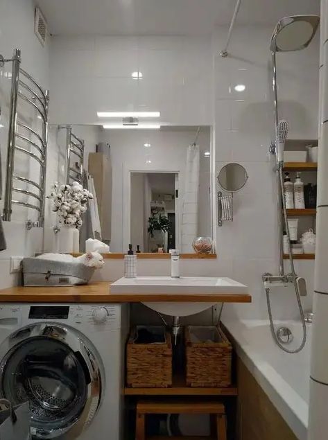 Picture of a modern white bathroom with a bathtub, an open timber vanity with a washing machine, a mirror and built in shelves Monochromatic Bathroom, Apartment Design Inspiration, Small White Bathrooms, Built In Vanity, Minimal Bathroom, Small Storage Cabinet, Timber Vanity, Modern White Bathroom, Small Bathroom Layout