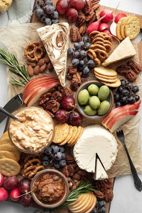 A beautiful vegan cheese board is perfect for parties and sure to wow your guests! From casual to fancy, vegan cheese plates (and even charcuterie boards) can be every bit as creative, unique, and impressive as their non-vegan counterparts! Read on to learn how to select the best vegan cheeses, what else you'll need to complete your cheese board, and how to pull it all together in no time. Vegan Cheese Board, Mini Food Appetizers, Vegan Cheese Boards, Cheeseboard Recipe, Vegan Stuffed Mushrooms, Best Thanksgiving Appetizers, Best Vegan Cheese, Vegan Appetizers Recipes, Vegan Queso