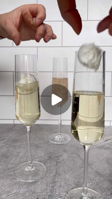 Emily Love Leserman on Instagram: "THE VIRAL CHAMPAGNE BALL DROP⁣ COCKTAIL
⁣
I saw this idea last week on @liv.yah and had to try it for myself! ⁣
⁣
this is such an easy cocktail, and the cotton candy/edible glitter bombs can be prepared way before your guests arrive⁣

replace Prosecco with sparkling cider for the kiddos! 
⁣
white cotton candy: @partycity 
edible glitter: prism powder from @fancysprinkles 
champagne: @mionettoproseccousa 
flutes: @crateandbarrel 
⁣" Champagne And Cotton Candy, Champagne With Candy Floss, Candy Floss Cocktail, Glitter Cotton Candy Champagne, Drink With Edible Glitter, Cotton Candy Glitter Drink, Edible Glitter Cocktails, White Cotton Candy, Cotton Candy Cocktail