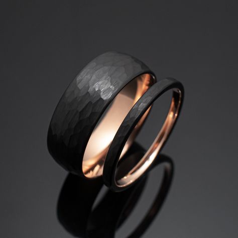 Your wedding ring set order includes + One 8mm Black Hammered Obsidian-styled tungsten Wedding Band with Rose Gold inlay + One 2mm Black Hammered Obsidian-styled tungsten Wedding Ring with Rose Gold inlay + Both Come inside Wax Sealed Ring Boxes. Limited Time: Free Matching Set of Black Silicone Bands w/ Order. *Durable - Incredibly Scratch-Resistant to always look great. *Comfort-fit & Weighty - Designed to fit well and feel good in your hand. *Made to order - Every ring we ship is unique and o Matching Bands His And Hers, Black And Rose Gold Wedding Rings, Black Wedding Bands His And Hers, Rings Engagement For Men, Rings Engagement Men, Obsidian Wedding Band, Wedding Band And Engagement Ring Set, Wedding Ring Men Gold, Black Wedding Bands For Men