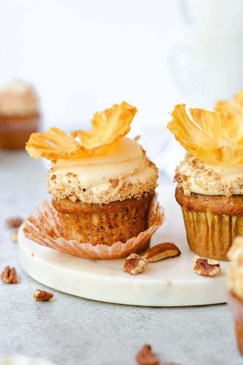 These Hummingbird Cupcakes are topped with luscious browned butter cream cheese frosting and beautiful pineapple flowers! Humming Bird Cupcake, Humming Bird Cupcake Recipe, Hummingbird Cupcakes Southern Living, Cupcakes For Spring, Fruit Cake Cupcakes, Hummingbird Cake Cupcakes, Hummingbird Cupcakes Recipe, Spring Cupcake Recipes, Natural Cupcakes