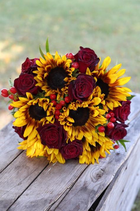 Wedding Bouquet filled with dyed sunflowers, berries, and Rosa Black Baccara roses. Fall Bridal Bouquet October, Flower Fall, Wedding Flowers Sunflowers, Sunflowers And Roses, Burgundy Bouquet, Fall Bouquet, Sunflower Wedding Bouquet, Sunflower Themed Wedding, Red Bouquet Wedding