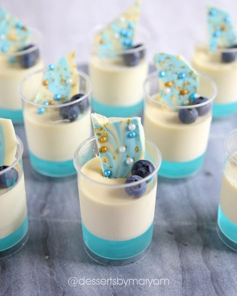 Vanilla bean Panacotta with blue jelly, topped with some white chocolate, blue and gold shards to go with the theme my customer was after.… Blue Party Desserts, Blue Dessert Ideas, Blue Dessert Table, Ocean Cupcakes, Ocean Birthday Cakes, Mini Dessert Cups, Dessert Table Birthday, White Desserts, Graduation Party Foods