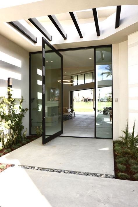 This Modern home features a 12' glass front door. The Simple features creates an eye drawing factor to this amazing front door. An Eye Drawing, Home Features, Glass Front Door, House 2, Dream Homes, Eye Drawing, Exterior Doors, An Eye, Entry Doors