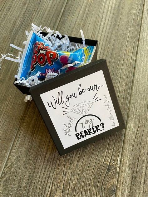 Best Ring Bearer Gifts To Make Him Feel Special- 18 Fantastic Choices Ring Pop Proposal, Ring Bearer Ring Security, Ring Security Ring Bearer, Security Ring Bearer, Groomsman Proposal Box, Ring Bearer Proposal, Best Ring, Ring Bearer Flower Girl, Groomsmen Proposal Gifts