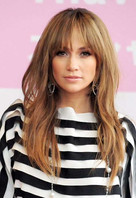 Bring a Brigitte Bardot-esque touch to your shaggy long locks with wispy bangs. Just make sure to blow them out after shampooing — frizzy bangs are the opposite of what you want with this look.  - GoodHousekeeping.com Celebrity Long Hair, Jennifer Lopez Hair, Celebrity Haircuts, Layered Hairstyles, Haircut Styles, Long Layered Haircuts, How To Style Bangs, Fringe Hairstyles, Long Hair With Bangs