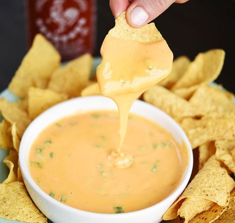 Who knew something so magical could be so easy? For more delicious Sriracha and cheese snacks, click here. Beer Queso, Cheesy Snack, Beer Cheese Dip, Cheese Snacks, Queso Dip, Snacks To Make, Yummy Dips, Cheese Dip, Appetizer Dips