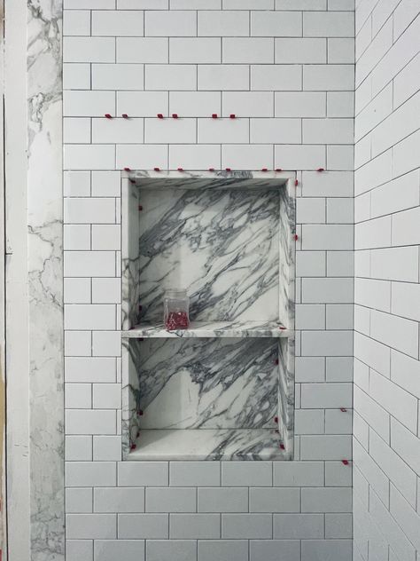 Work in progress, calacatta marble shower niche surrounded by 4x6 subway tiles Marble Shampoo Niche, Marble Bathroom Niche, Marble Shower Shelf, Marble Shower Surround, Marble And Subway Tile Bathroom, Shower Niche Marble, Quartz Shower Niche, Long Shower Niche, Double Shower Niche