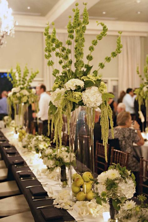 green and white arrangements of hydrangea, bells of Ireland, hanging amaranthus Hanging Amaranthus, Bells Of Ireland, Green Centerpieces, Wedding Reception Flowers, Wedding Event Decor, Wedding Favors Fall, Tall Centerpieces, Fall Arrangements, Amazing Weddings