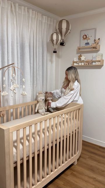 Ani Goulayan on Instagram: "Decorate my nursery with me 🩵 Tags for everything below: I’ll also post direct links in stories 🫶🏼 Furniture: RH baby and child Shelves, wooden toys and books on my Amazon storefront Rug: @westelm Hot air balloon & paintings: @etsy Giraffe: @potterybarnkids Drawers and organizers: @ikea Knitted animals: @cuddleandkind Stars and moon mobile: @etsy Glider chair: @worldmarket Now we’re finally ready for baby to come 🫶🏼" Nursery Room Hot Air Balloon, Ballon Nursery Decor, Hot Air Balloon Baby Nursery Theme, Nursery Ideas Hot Air Balloon, Hot Air Balloon Nursery Theme, Hot Air Balloon Nursery Decor, Nursery Aesthetic, Nursery Idea, Moon Mobile