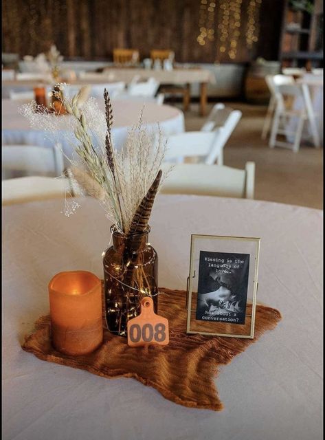 Dried grass arrangements Boho Western Centerpieces Wedding, Cowhide Centerpiece Wedding, Western Flower Arrangements Wedding, Western Wedding Tables, Western Flower Arrangements Decor, Boho Western Flower Arrangements, Dried Grass Arrangements, Western Theme Floral Arrangements, Western Table Centerpieces