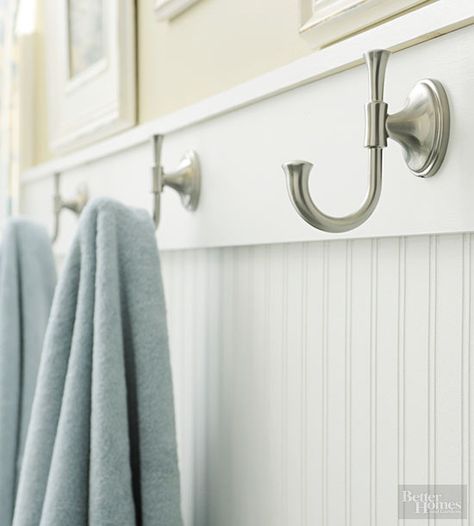 Beaded-board panels provide a fetching foundation for beach-style bathrooms. Coastal Towel Hooks, Bathroom Hooks For Towels Master Baths, Bead Board With Hooks, Towel Hooks For Bathroom, Bead Board In Bathroom, Shower Towel Hooks, Beach Bathroom Design, Bath Towel Hooks, Beach Style Bathroom