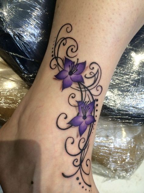 Purple Tattoos For Women, Purple Tattoo Ideas, Flowers And Butterflies Tattoos, Purple Flower Tattoo, Purple Flower Tattoos, Black Flowers Tattoo, Purple Tattoos, Flower Tattoo Meanings, Ankle Tattoos