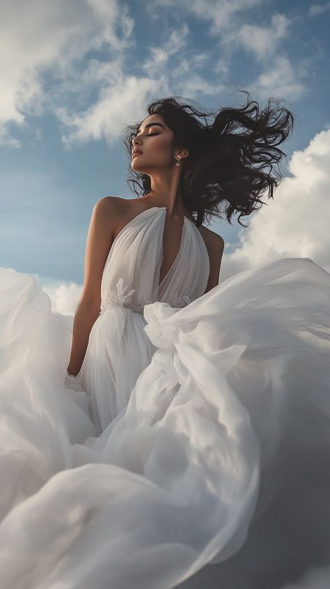 Embrace celestial elegance in a Libra-inspired floating silk gown, channeling an air goddess against a dreamy cloud backdrop for an ethereal editorial wonder. Big Dress Photoshoot, Ball Gown Photoshoot, Allegorical Paintings, Ethereal Dress Goddesses, Ethereal Editorial, Ethereal Photoshoot, Air Goddess, Cloud Backdrop, Cloud Dress