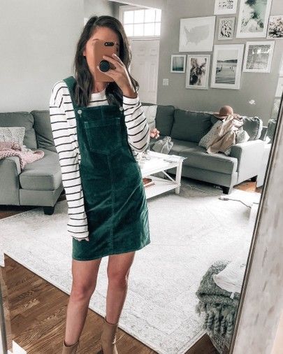 green corduroy overall dress layered with striped tee, tan booties, fall outfit inspo, fall style ideas @prettyinthepines Overall Dress Outfit, Corduroy Dress Outfit, Pants Colorful, Corduroy Overall Dress, Fall Pants, Winter Dress Outfits, Fall Dress Outfit, Trending Fashion Outfits, Corduroy Dress