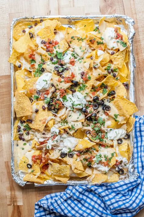 Sheet Pan Queso & Chicken Nachos Recipe | eHow Shredded Chicken Leftovers, Best Nachos, Queso Chicken, Mexican Food Recipes Appetizers, Sheet Pan Nachos, Pan Nachos, Chicken Nachos Recipe, Nachos Recipe Easy, Chicken Nachos