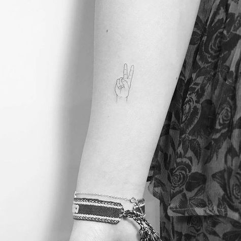 V sign tattoo on the right forearm. Peace Sign Tattoo, Peace Sign Tattoos, Peace Tattoos, Matching Friend Tattoos, Couple Matching Tattoo, Sign Tattoo, Small Finger Tattoos, Finger Tattoo For Women, Small Forearm Tattoos