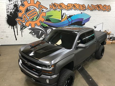 2016 Chevy Silverado wrapped in 3M Satin charcoal wrap with gloss black hood center, roof, tailgate between taillights, and between two door glasses. 2017 Chevy Silverado 1500 Lifted, Truck Wraps Ideas, Lamborghini Vision Gt, Aesthetic Beautiful Wallpaper, Car Tattoo Design, 2016 Chevy Silverado 1500, Chevy Silverado 2017, 2016 Chevy Silverado, Cars Tattoo