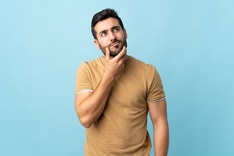 Young handsome man with beard over isola... | Premium Photo #Freepik #photo #man-question #confused-man #man-thinking #person-thinking Confused Person, Man With Beard, Man Beard, Handsome Man, Social Media Design Graphics, Media Content, Social Media Content, Bearded Men, Premium Photo