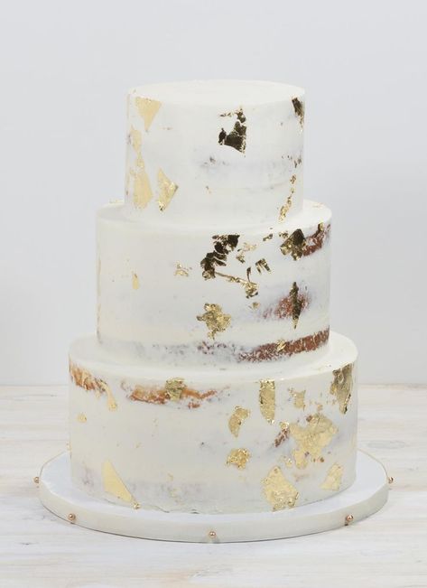 Modern White & Gold Wedding Cake | Good leaf on white buttercream cake Gold Foil Wedding Cake, Wedding Cake Gold Leaf, 16 Aesthetic, White And Gold Wedding Cake, Semi Naked Cake, White And Gold Wedding, Wedding Cake Prices, White Buttercream, Small Wedding Cakes